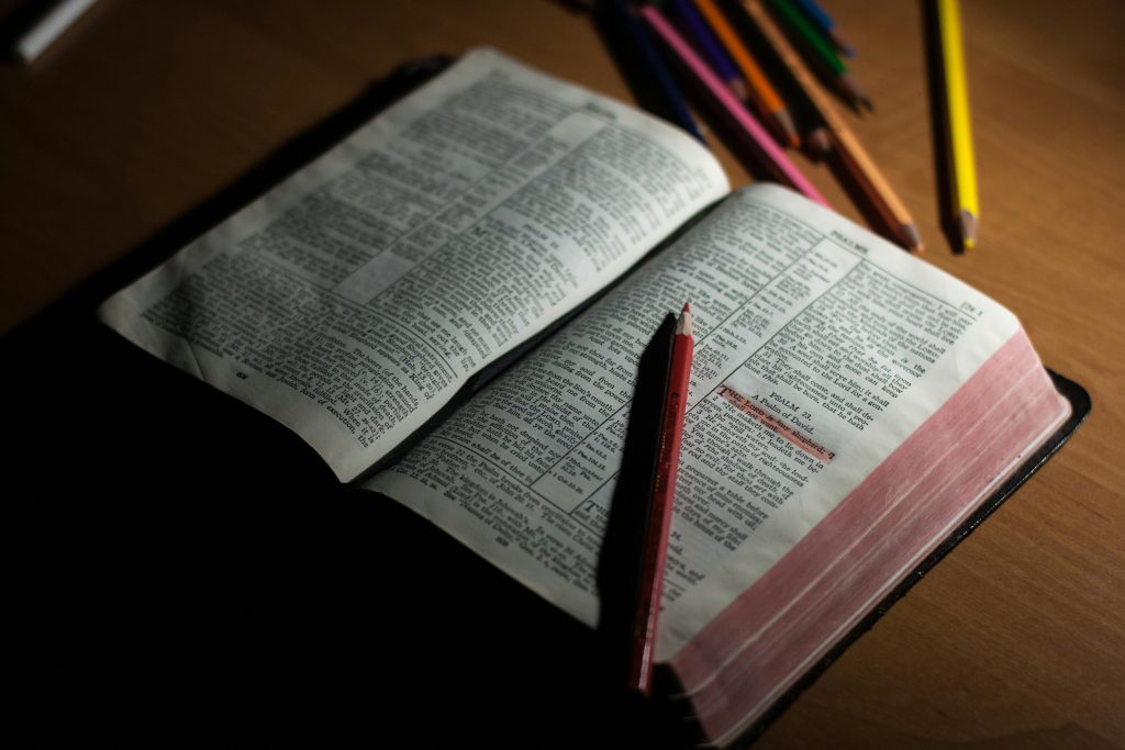 The bible opened with a pencil on it
